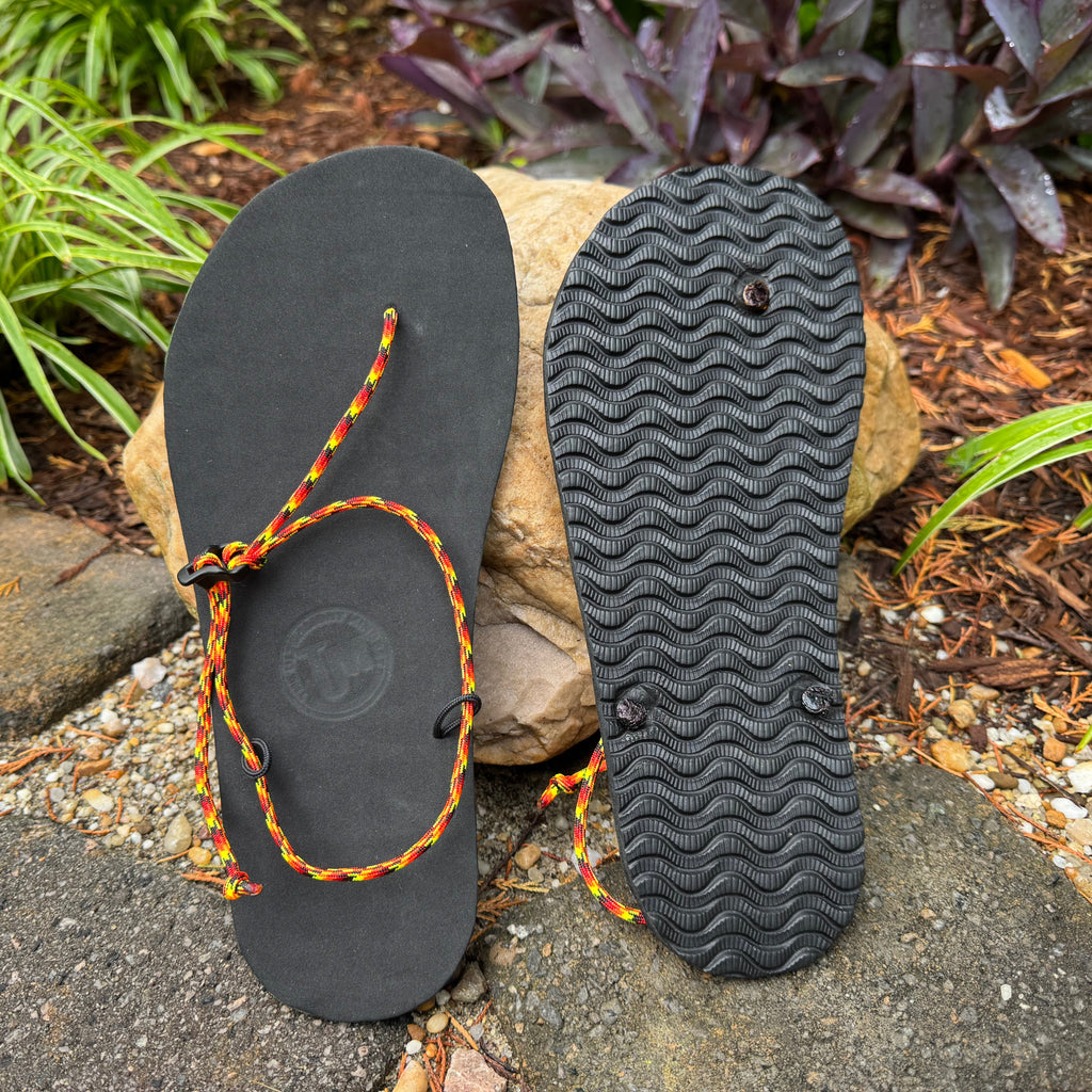 Ultralight Adventure Sandal with multicolor cord and grippy tread pattern for hikers, travelers, and minimalist barefoot enthusiasts.