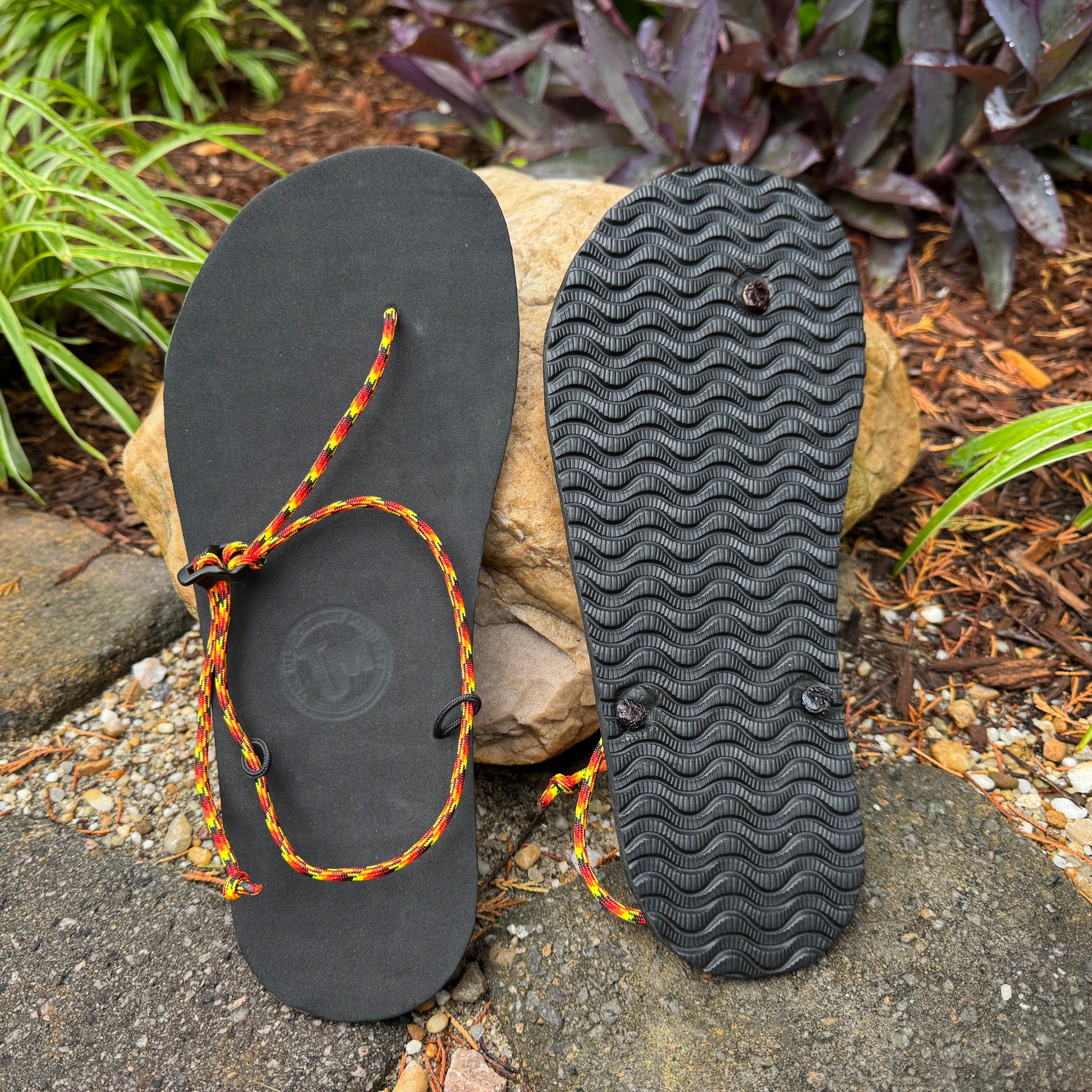 Ultralight Adventure Sandal with multicolor cord and grippy tread pattern for hikers, travelers, and minimalist barefoot enthusiasts.